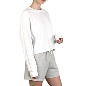Aritzia TNA Action spell out cropped white boxy oversized long sleeve t shit XXS